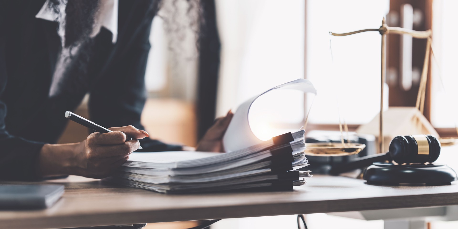 Lawyer business woman working or reading lawbook in office workplace for consultant lawyer concept
